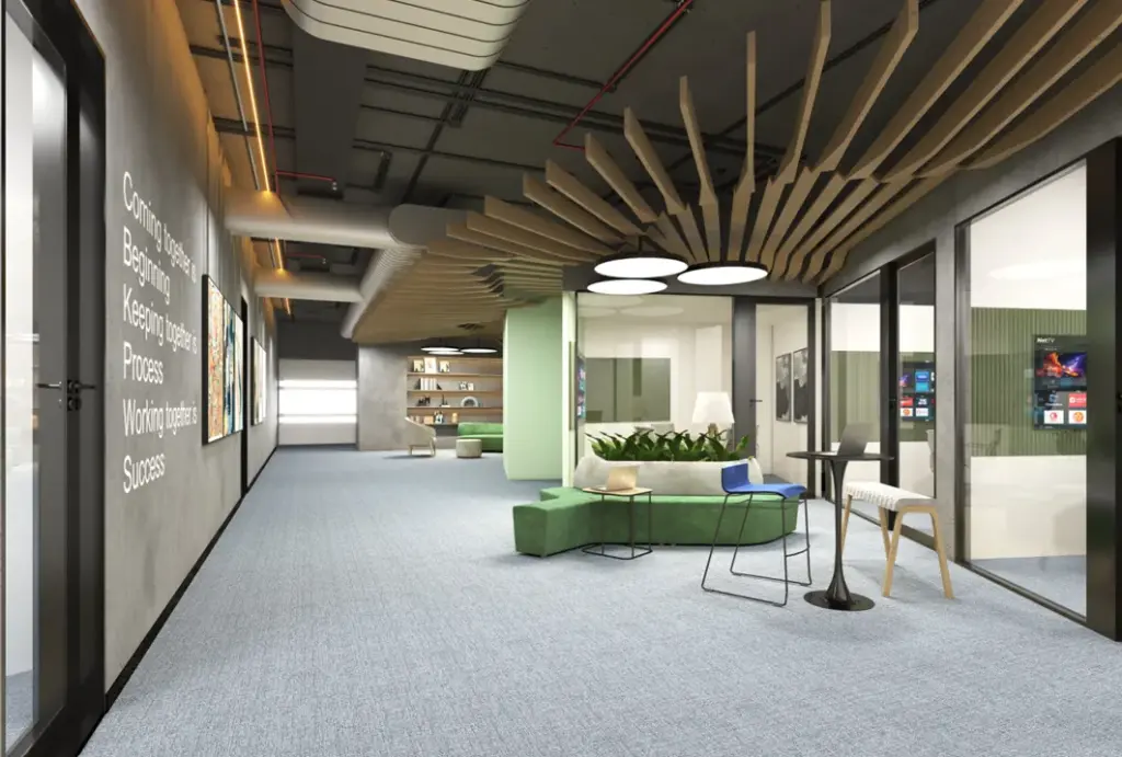 Office breakout area with grey carpet tiles and green seating